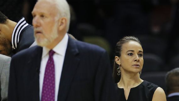 San Antonio Spurs head coach Gregg Popovich (left) and assistant coach Becky Hammon